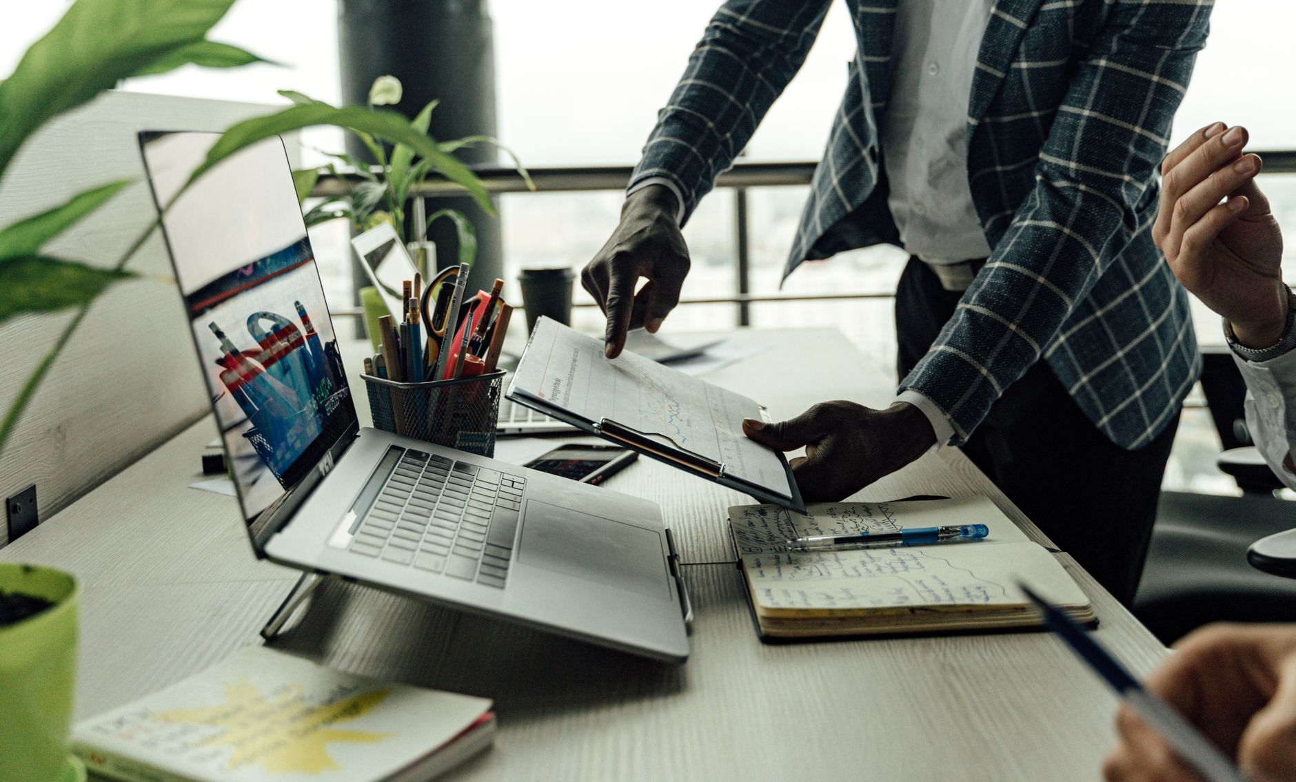 Colleagues collaborating on financial data analysis with a laptop in the office. — Automate Your Workflow with Reliable Stude