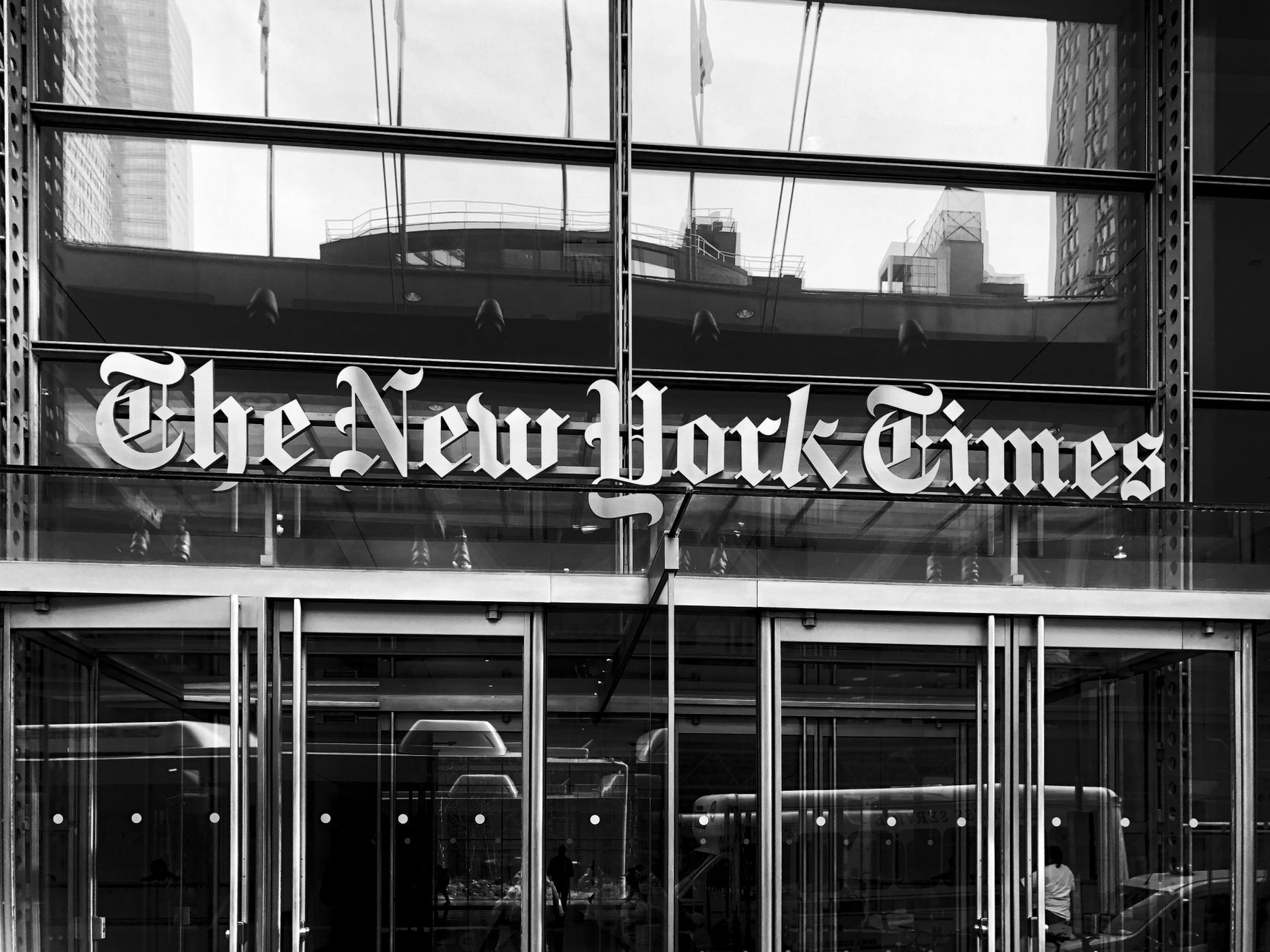 Grayscale image of The New York Times building entrance in New York City. — Revamp Your Ride: The Ultimate Guide to Automotiv